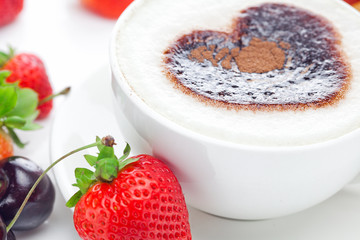 cappuccino in a cup in the shape of hearts,cherry,croissant  and