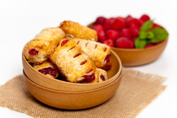 Raspberry filled pastries with sugar sprinkles