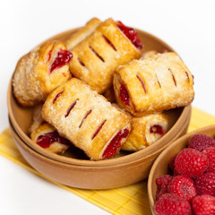Raspberry filled pastries with sugar sprinkles