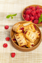Raspberry filled pastries with sugar sprinkles