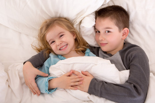 Mischievous Young Brother And Sister In Bed