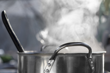 Naklejka na ściany i meble steam on pot in kitchen