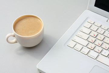 cup near the laptop