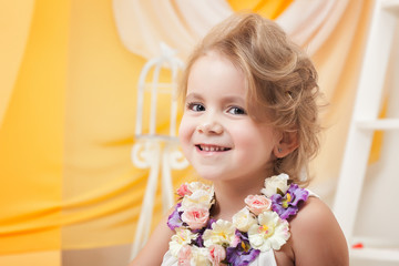 Obraz na płótnie Canvas Portrait of cute little girl smiling at camera