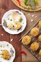 Baked eggs, stuffed with ham and parsley