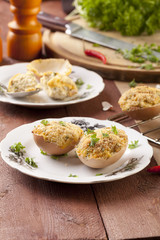 Baked eggs, stuffed with ham and parsley