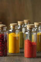 Fototapeta na wymiar Spices in bottles