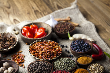 Spices on wooden bowl background 