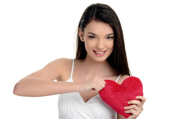 Girl tearing up a red heart.Heart broken,angry.Valentine day.