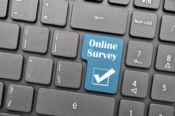 Online survey key on keyboard