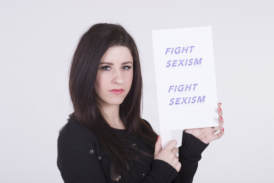 Fight Sexism young woman holding protest notice