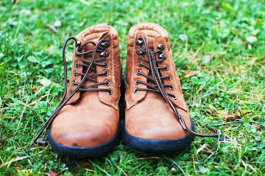 Brown leather boots in the grass