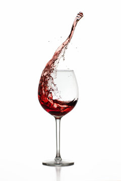 Red Wine Splashing in Glas