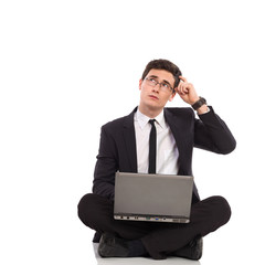 Elegance male student with laptop thinking.