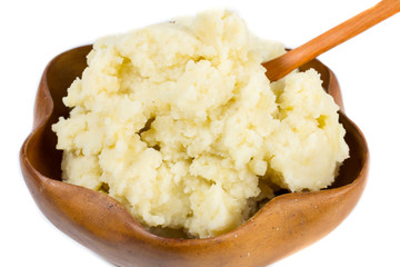 Mashed potatoes on wooden bow