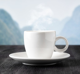 Cup of coffee on highlands background