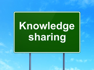 Education concept: Knowledge Sharing on road sign background