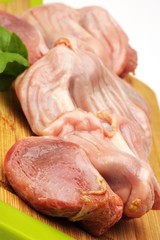 raw stomachs with turkey on a wooden board