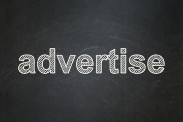 Obraz premium Advertising concept: Advertise on chalkboard background