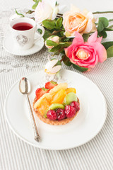 Tartlet with fresh fruits and berries, closeup