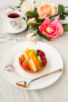Tartlet with fresh fruits and berries, closeup