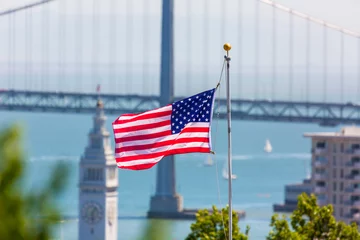 Tuinposter San Francisco USA American Flag Bay Bridge and Clock tower © lunamarina