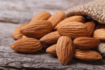 almonds in a sack on an old wooden table