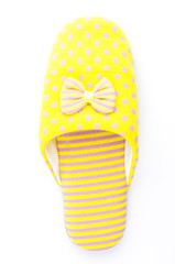 Yellow house slippers isolated on white background