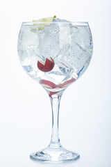 grape and lime gin tonic isolated over white