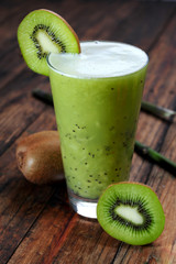 Kiwi juice on wooden background