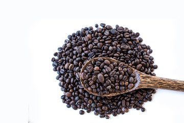 Fototapeta na wymiar Coffee beans on wood spoon