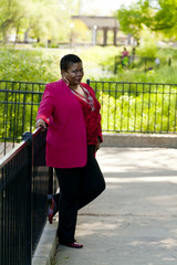 Middle-Aged Woman Standing Outdoors Pants Red Jacket