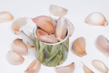 Garlic in green cup.