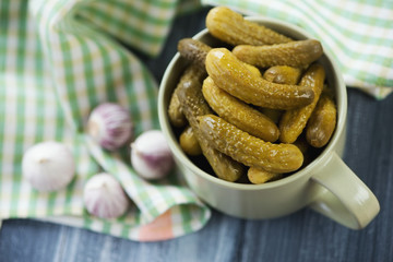 Above view of pickled cucumbers on a kitchen table