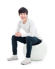 Young Asian person sitting on the chair.