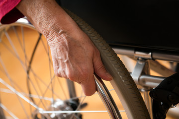 old hand on wheel