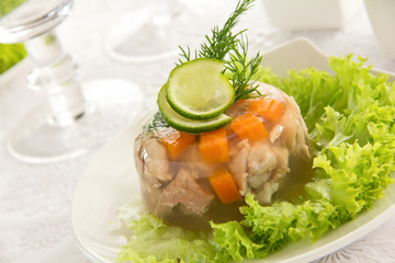 meat jelly with vegetables and sauce.