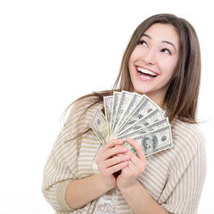 Cheerful attractive young smiling woman holding cash, dreaming a