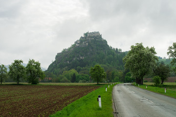 Landscape of rural Austria and road to the old castle on hill 