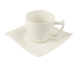 Tea cup over a square plate isolated