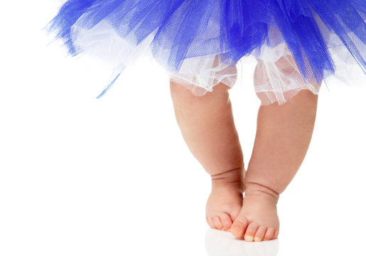 baby girl like a ballet dancer in blue tutu, isolated on white