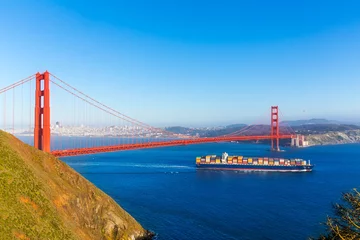 Fotobehang San Francisco Golden Gate Bridge merchant ship in California © lunamarina
