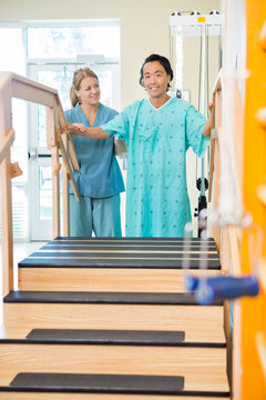 Patient Being Assisted By Physical Therapist