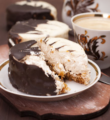 Cake with frosting of white and dark chocolate.