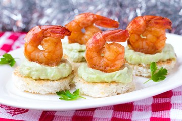 Shrimp on toast with guacamole sauce avocado, Christmas tasty