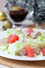 Delicious fresh salad with grapefruit, chicken, lettuce, cheese