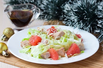 Delicious fresh salad with grapefruit, chicken, lettuce, cheese