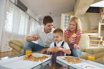 family eating pizza