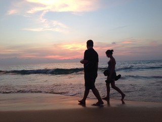 Sunset walking people at the beach
