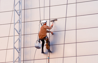A man cleaning windows